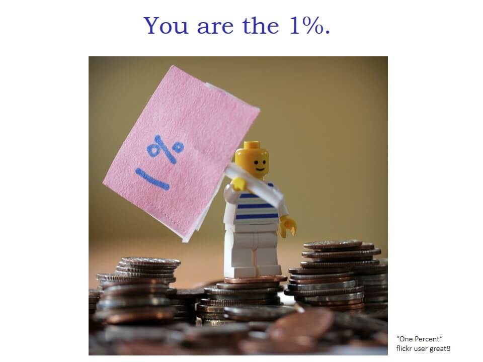 "You are the 1%" and a photo of a Lego mini-figure holding a 1% sign and standing with piles of coins.